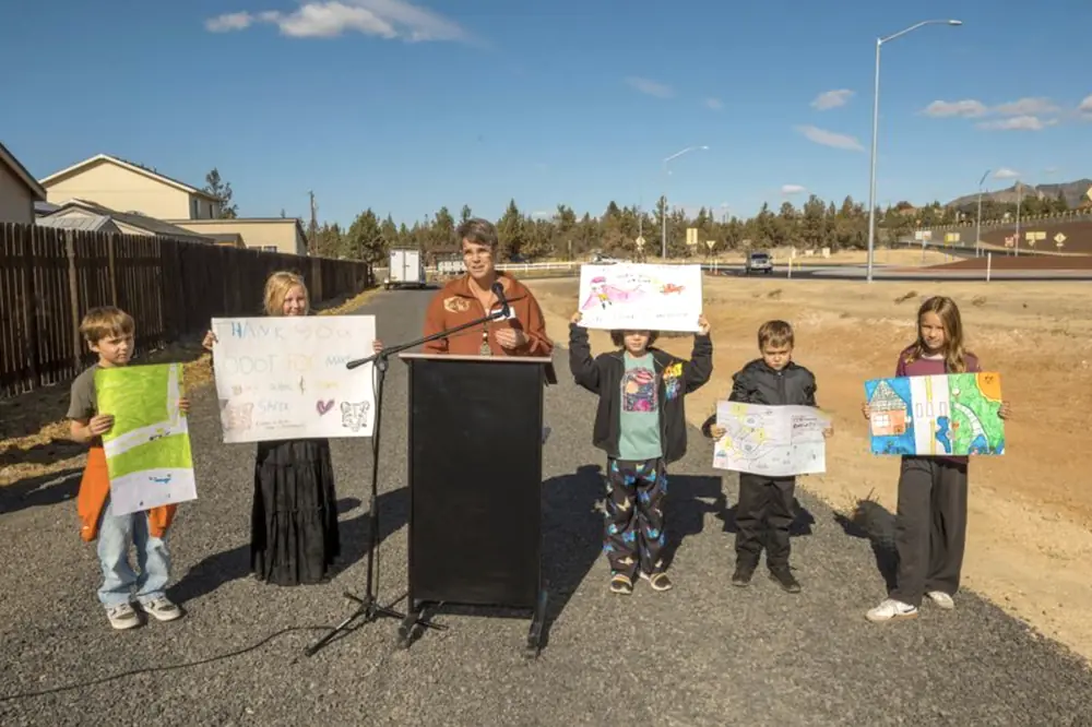 Terrebonne Community School's Principal Cyndi Ganfield is joined by students Easton, Elanor, Inga, Nate, and Pria, whose posters display what safe roads mean to them.