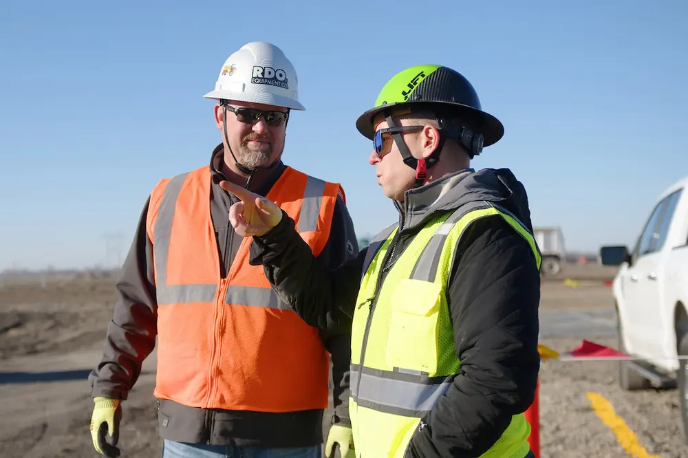 Scott Weness (left), Regional Sales Manager at RDO Equipment Co., visits Steve Westlund (right) on the 900-acre data center development project.