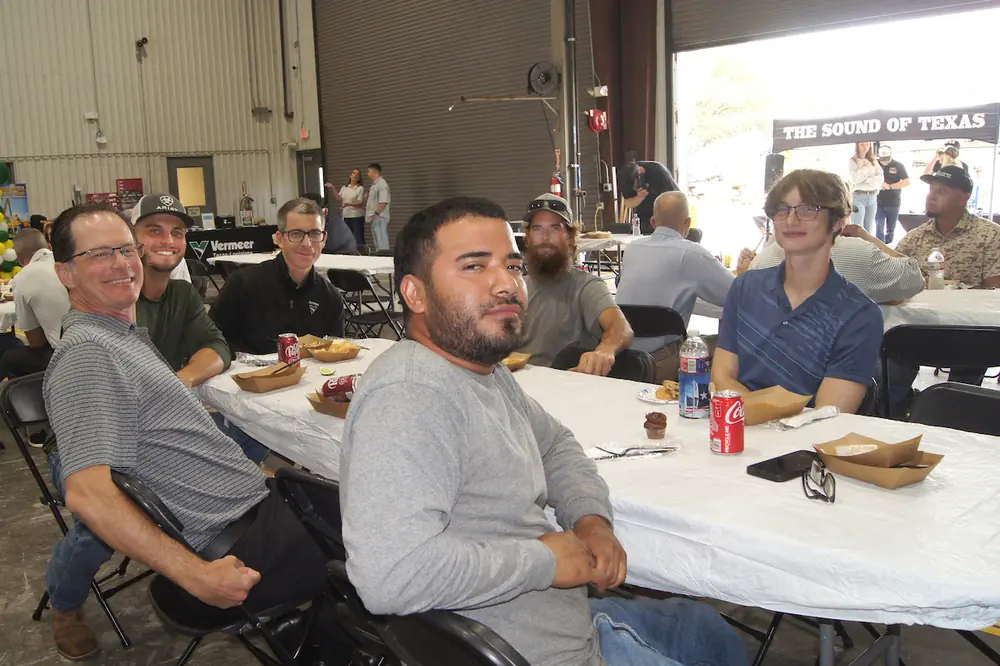 The first customer to arrive at the new Weatherford dealership was Deadwood Tree Service, a locally owned business. Pictured here, they enjoyed the Tex-Mex lunch served at the grand opening.