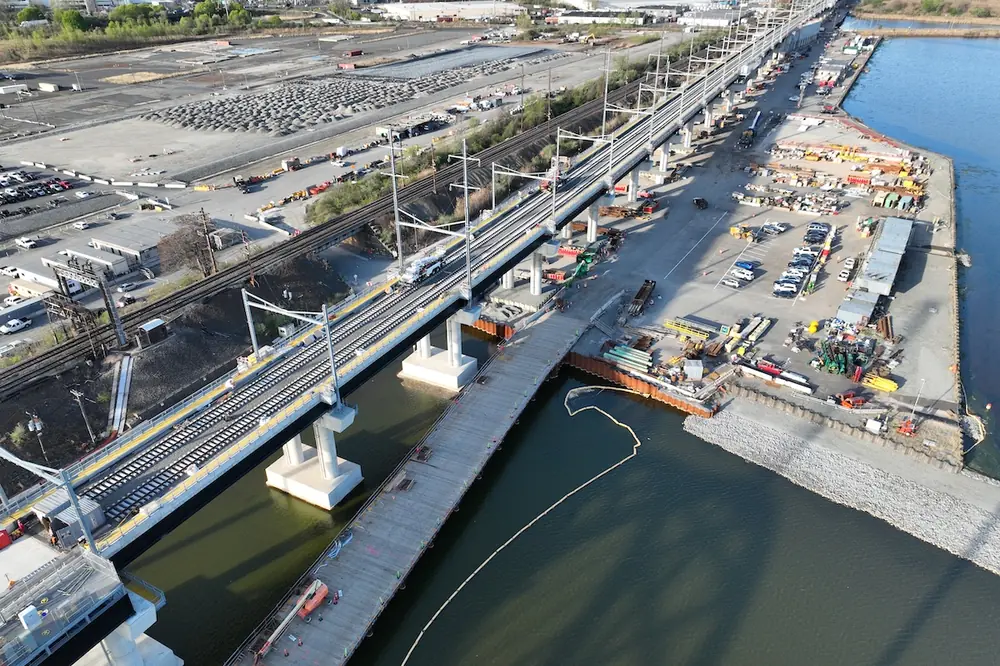 Crews work on the Portal North Bridge adjacent to the old structure. (Photo courtesy of Skanska)