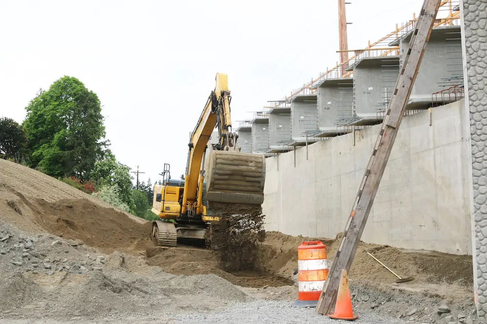 Soil is removed using a Komatsu PC170LC Excavator around the Des Moines Memorial Drive bridge in SeaTac.