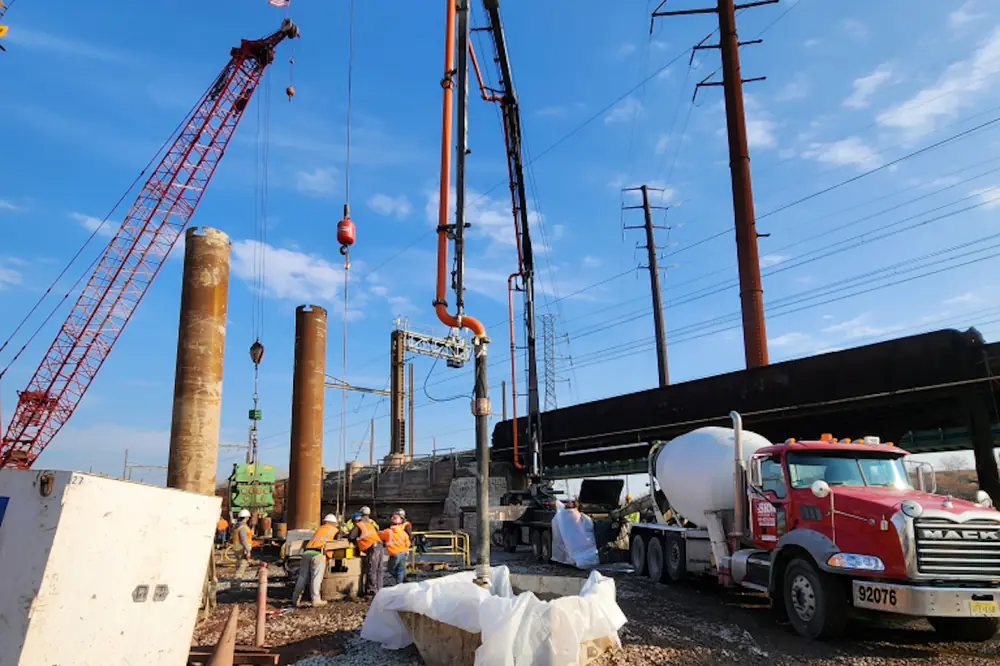 Crews place concrete into drilled shafts at the northeast abutment. (Photo courtesy of NJ Transit)