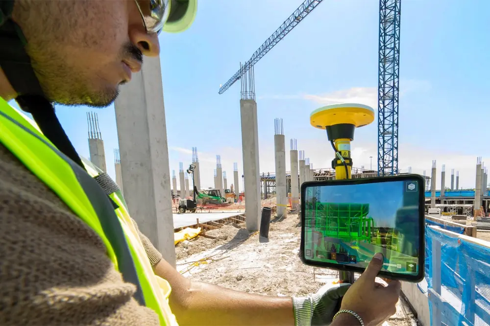 A JE Dunn team member compares the job site to a digital model.