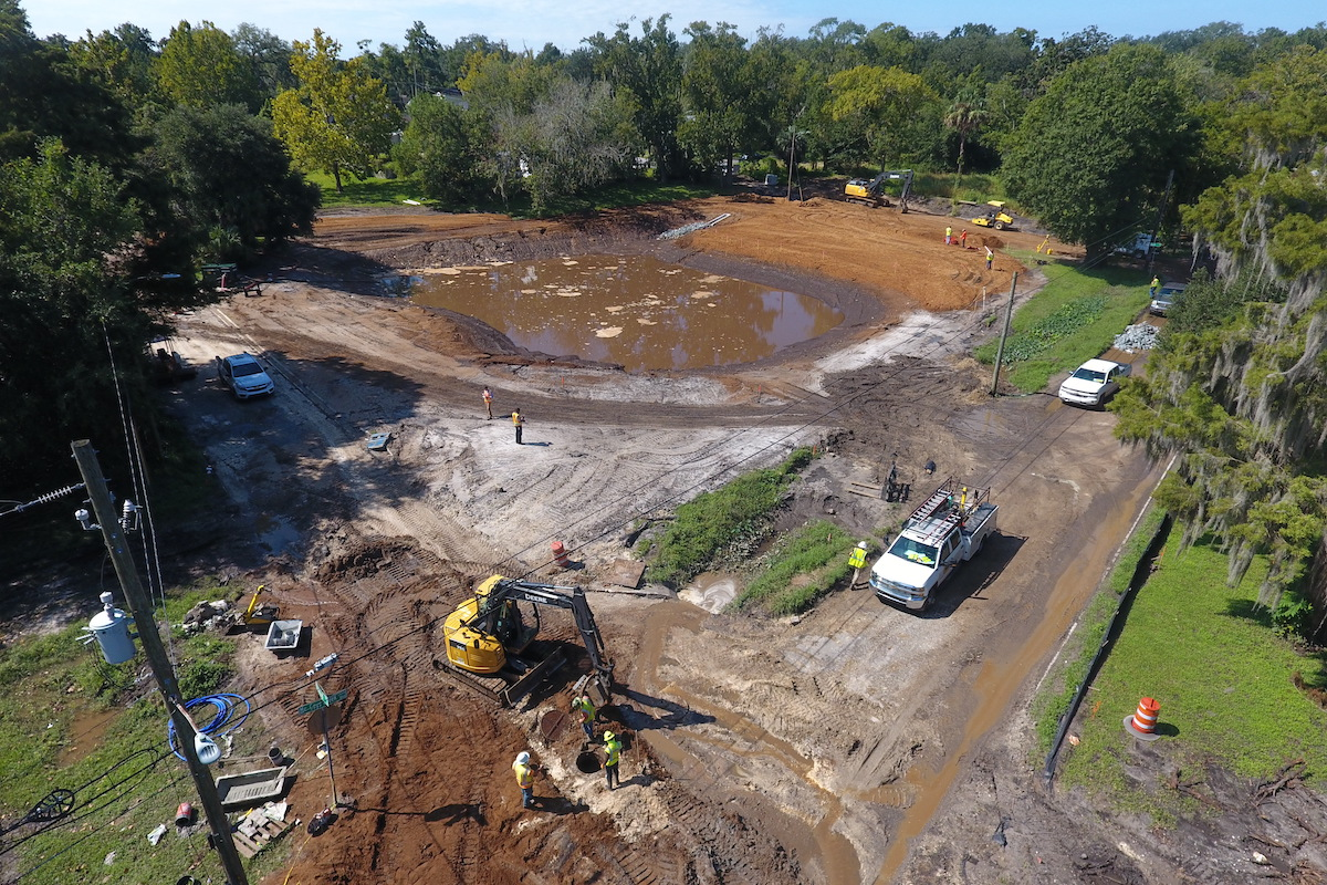 The team works on turning the retention pond at the intersection of Broward Street and McCoys Creek Boulevard into a park.