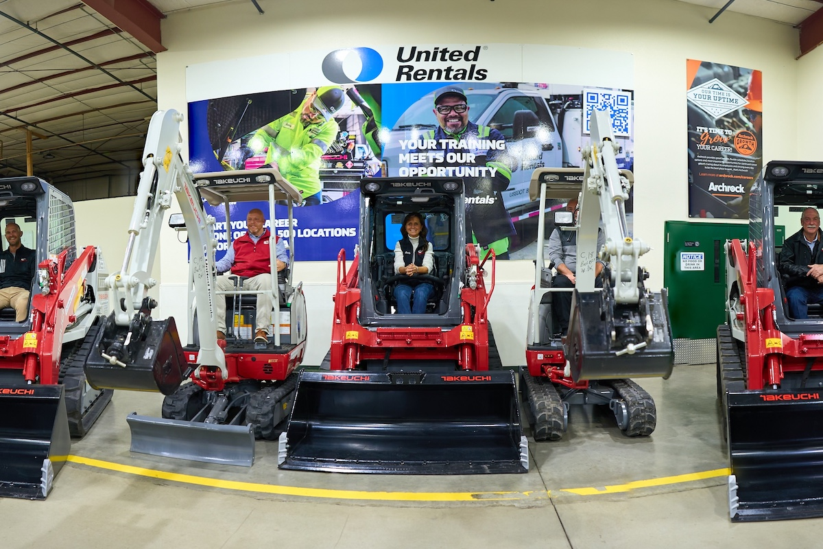 Executives from WyoTech, United Rentals, and Takeuchi get behind the controls of three Takeuchi TL8R2 Compact Track Loaders and two Takeuchi TB216 Compact Excavators. The machines will be used in WyoTech’s diesel technology program.