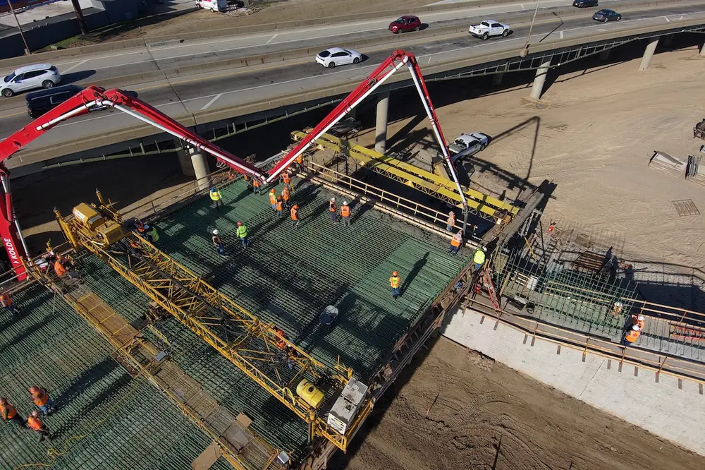 The project’s first deck pour takes place on the new eastbound viaduct. (Photo courtesy of Kansas Department of Transportation)