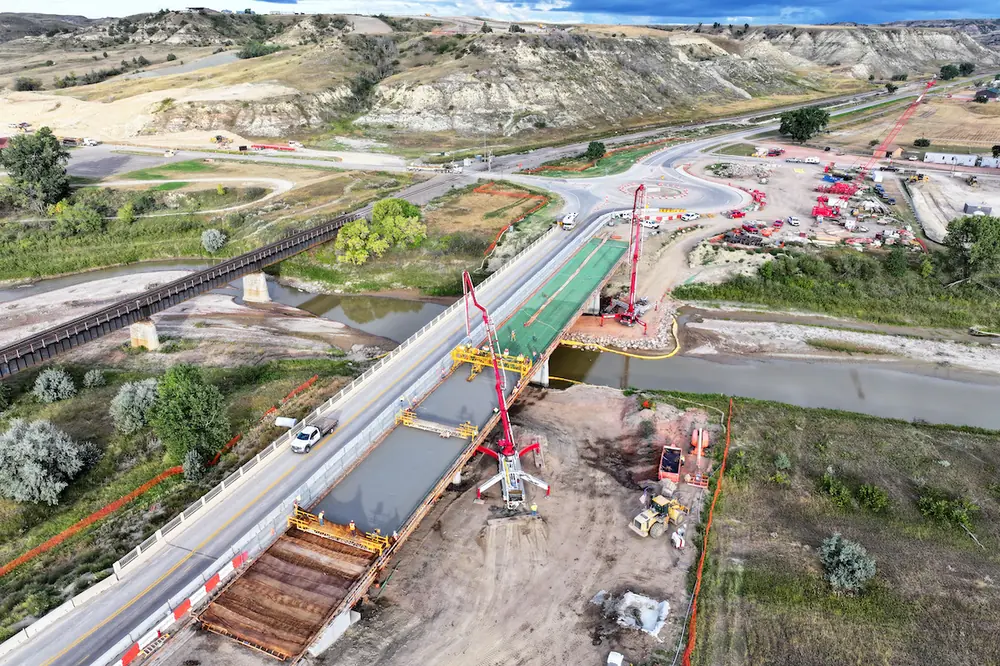 Crews pour the new section of a bridge over the Little Missouri River in Medora, North Dakota.