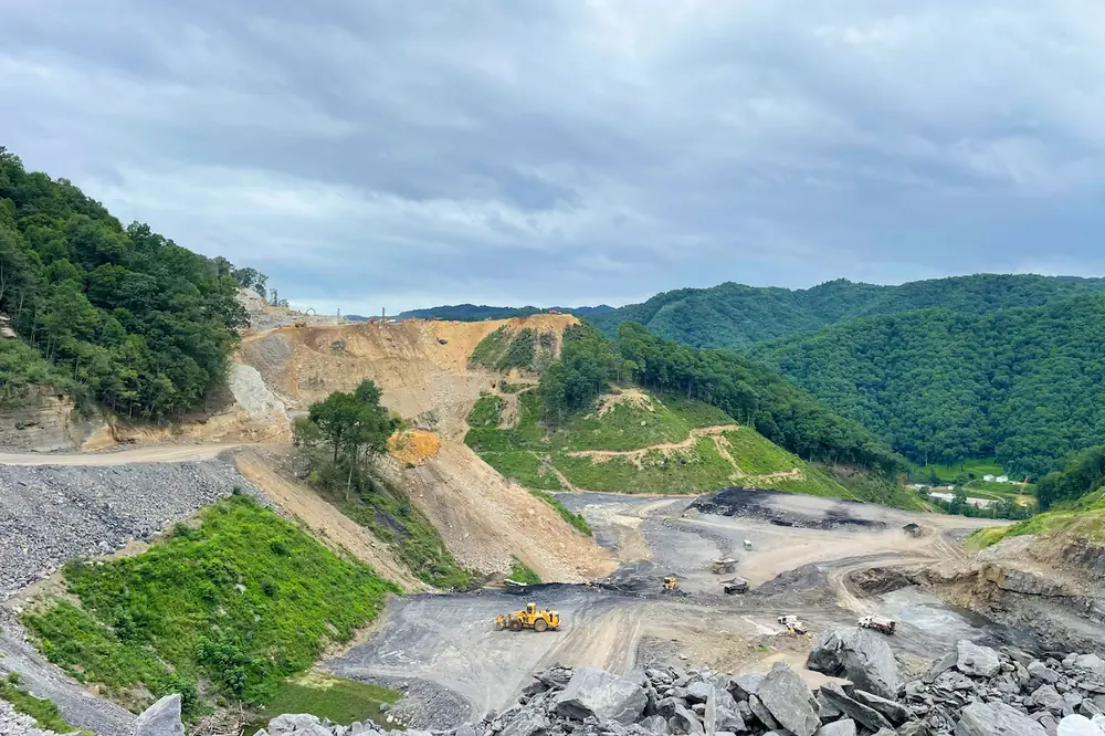 Crews continue efforts to place material in a waste area near the connection to Route 460 at Grundy.
