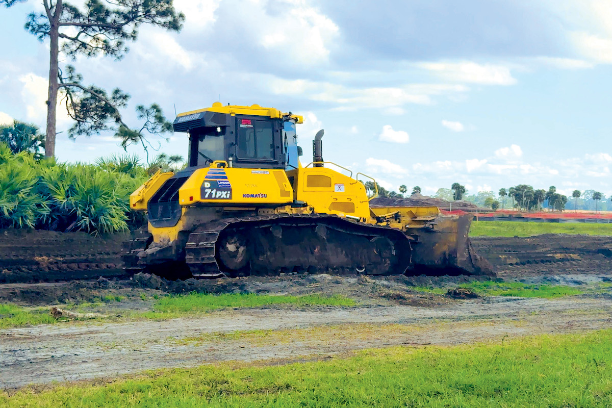 An operator cuts a road to grade with a Komatsu D71PXi-24 Intelligent Machine Control Dozer.