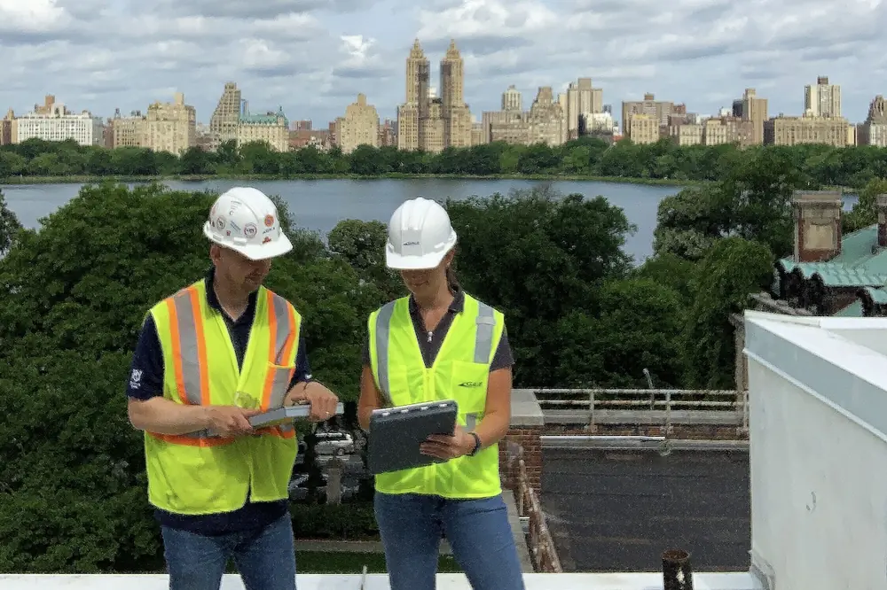 Gale employees collaborate during a project site meeting.