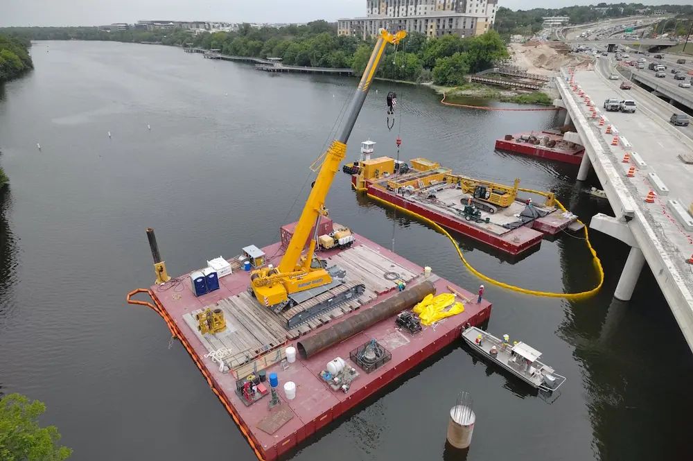 As part of the I-35 Capital Express Central project, the Lady Bird Lake bridge is being constructed on barges. (Photo courtesy of Dustin Doerschlag of RS&H Inc.)