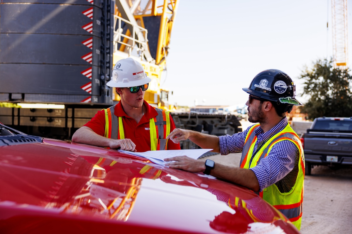 Austin Ashley, Project Engineer I, and Aaron Kidd, Assistant Project Manager II, coordinate on Superior Construction's Brooks Bridge Replacement project in Florida.