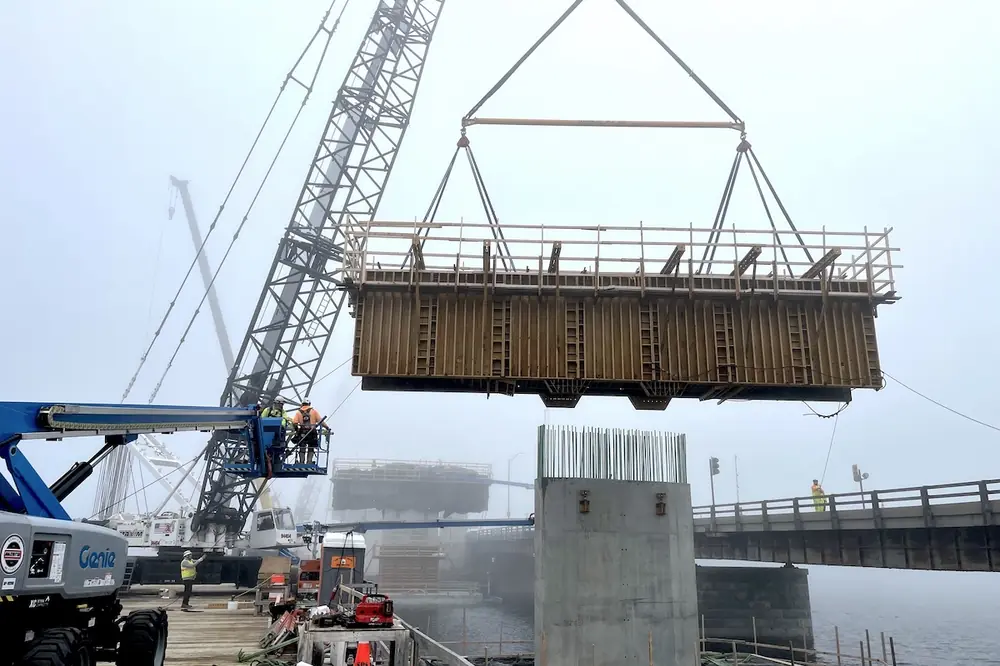 To the west of the existing bridge in Hampton, New Hampshire, the construction team is building a fixed, steel superstructure approximately 1,300 feet long.
