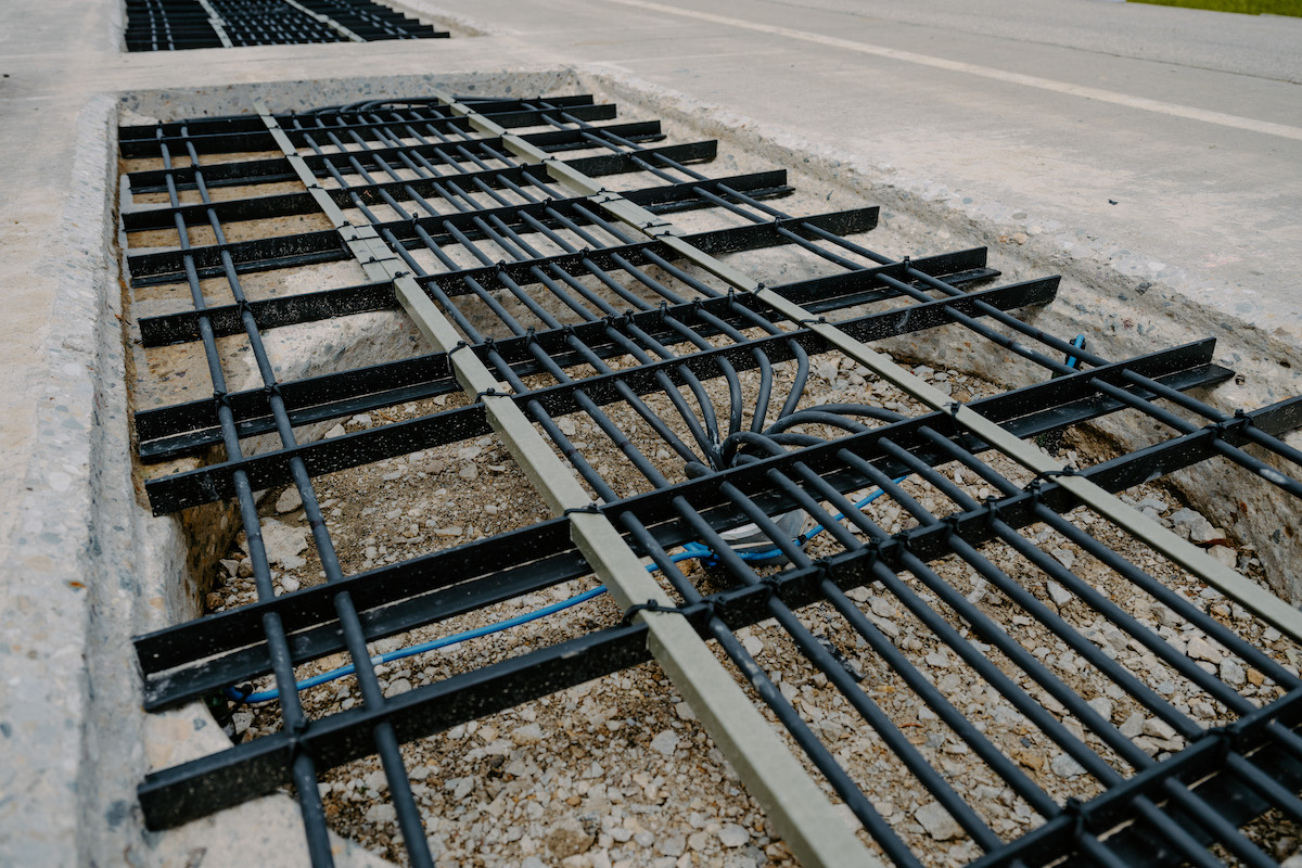 INDOT embedded these Purdue-designed coils before covering them with concrete highway pavement. The coils transmit power to receiver coils attached to the underside of an electric heavy-duty truck.