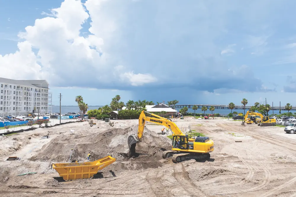 An operator uses a Komatsu PC360LC-11 Excavator to place material at Sitecrafters’ job site.