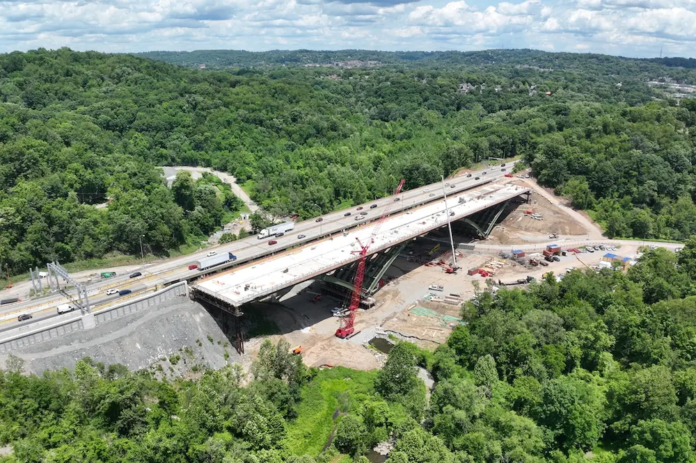 The completed new Commercial Street Bridge, foreground, in early July 2026 before demolition of the former bridge.