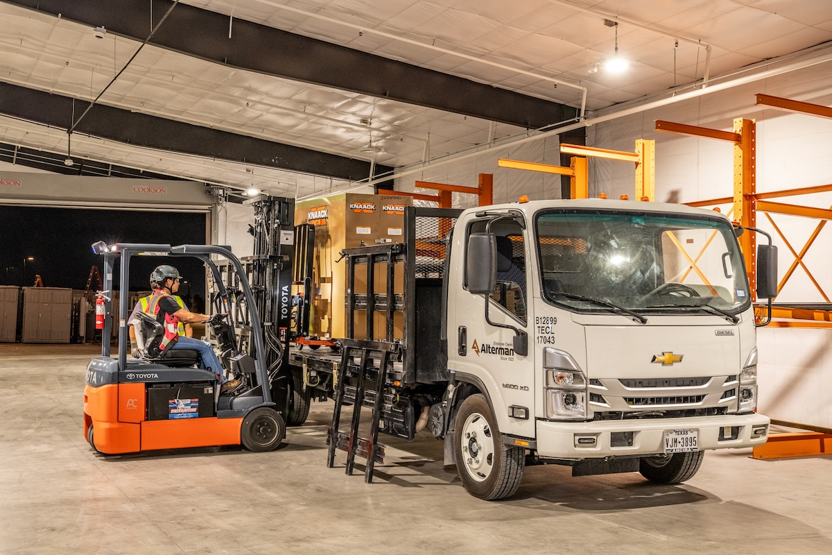 A logistics team coordinates delivery of kits to the job site two days before installation.