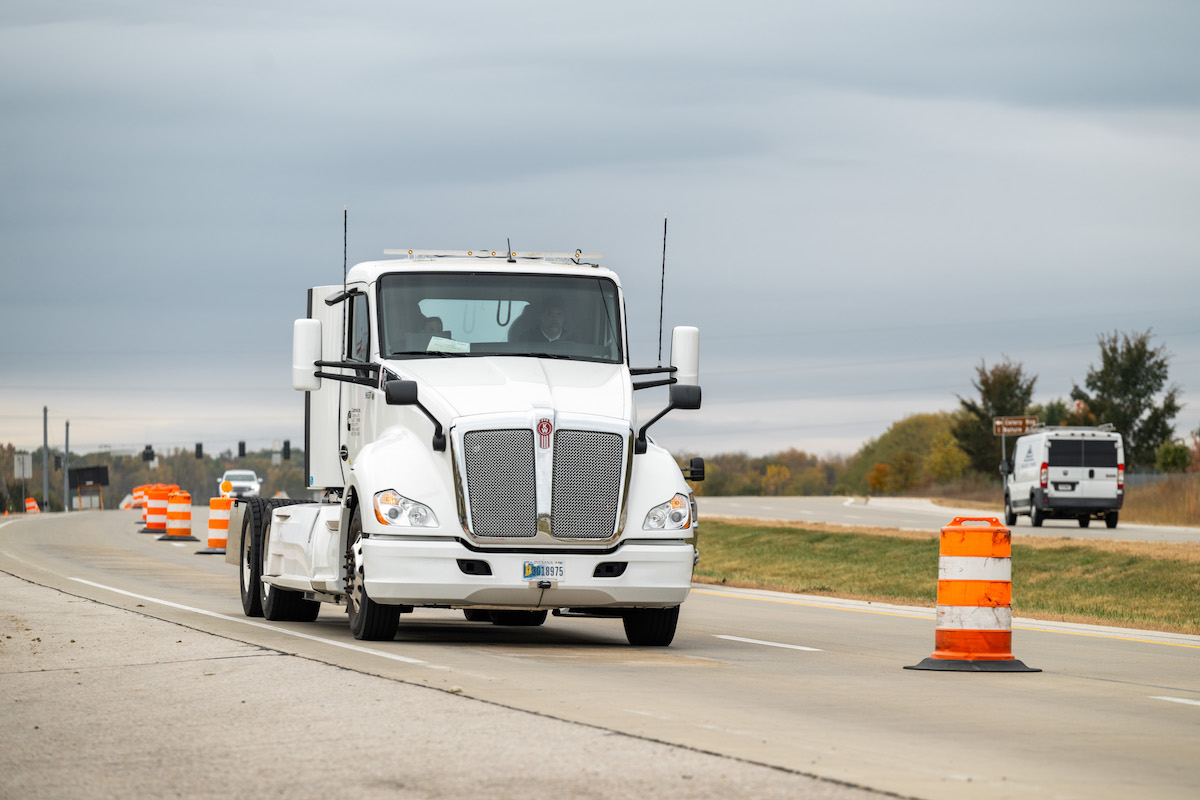 An electric Cummins heavy-duty truck charges as it drives along a test segment on U.S. Highway 52/U.S. Highway 231 in West Lafayette.