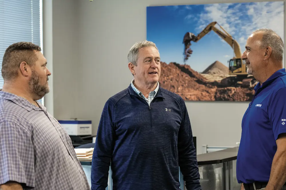 From left to right: LEO Construction’s Frank Thyson and Michael Rose work closely with Linder Sales Representative John Rocca for sales, service, and support on their nearly 30 pieces of Komatsu equipment.