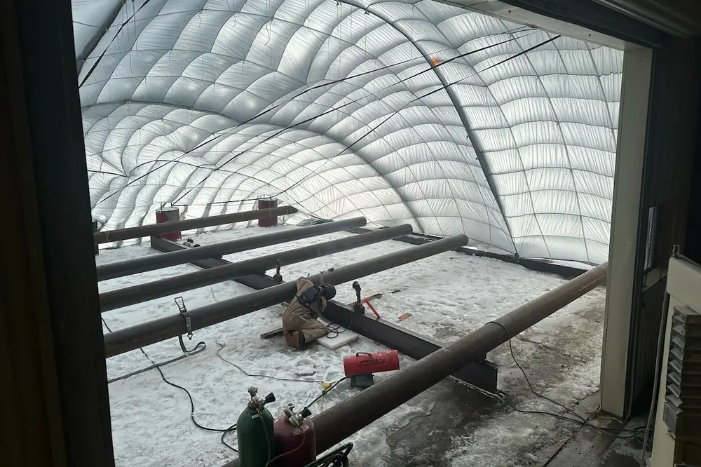 This Wyoming project used parachutes and portable heaters to raise temperatures in the work area from below zero to nearly 50 degrees.