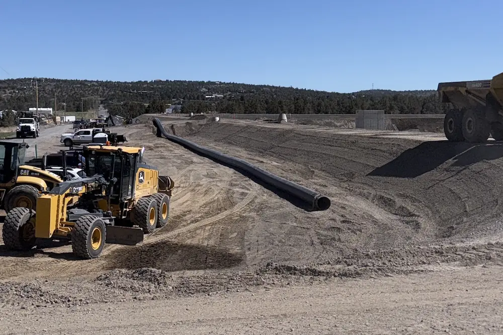 Crews weld sections of the 24-inch HDPE internal recycle line before installation along the treatment lagoons. (Photo courtesy of Anderson Perry)