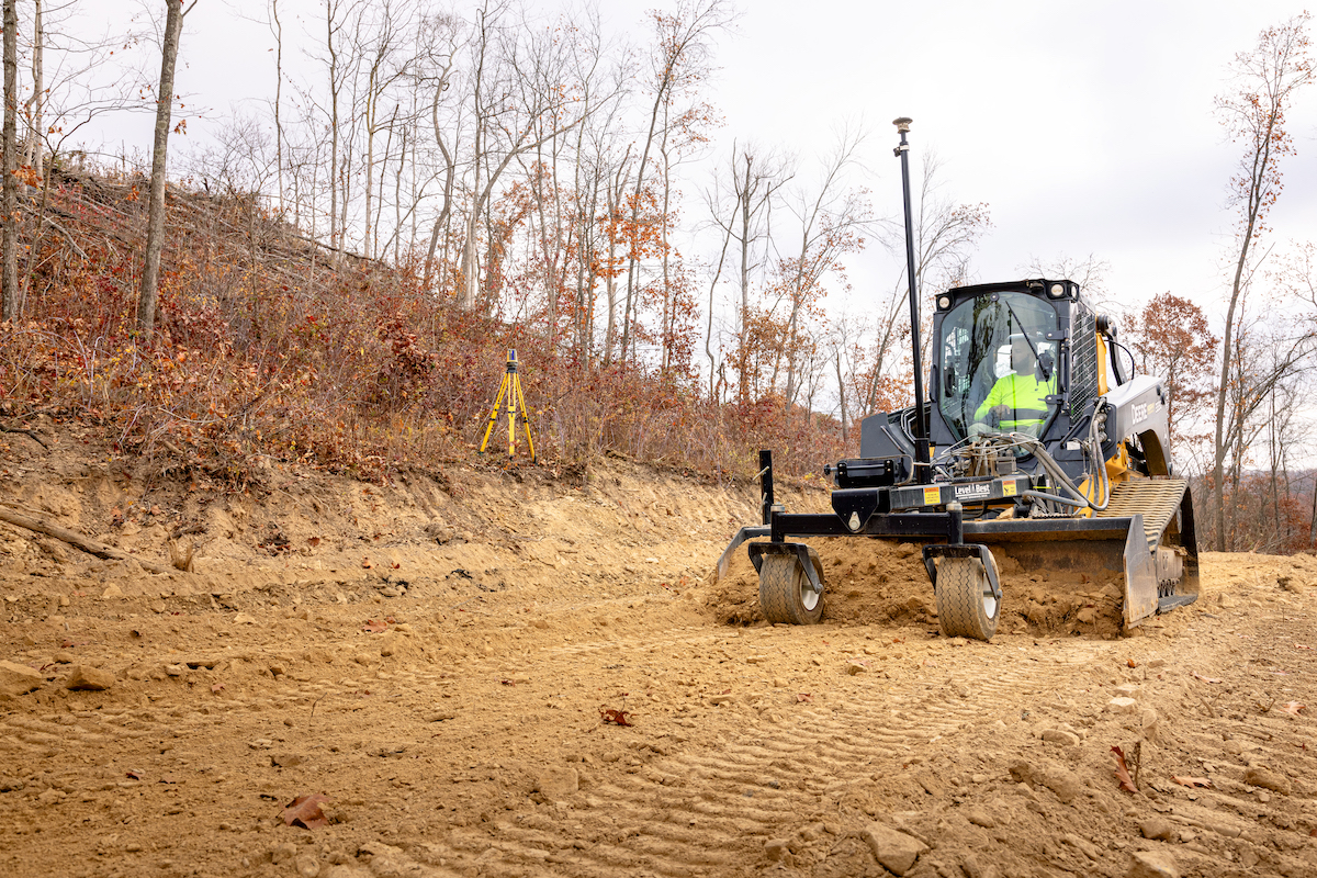Graham Excavating uses a Level Best box blade on a John Deere 333G Compact Track Loader, then controls it all with the Topcon MC-Mobile solution.