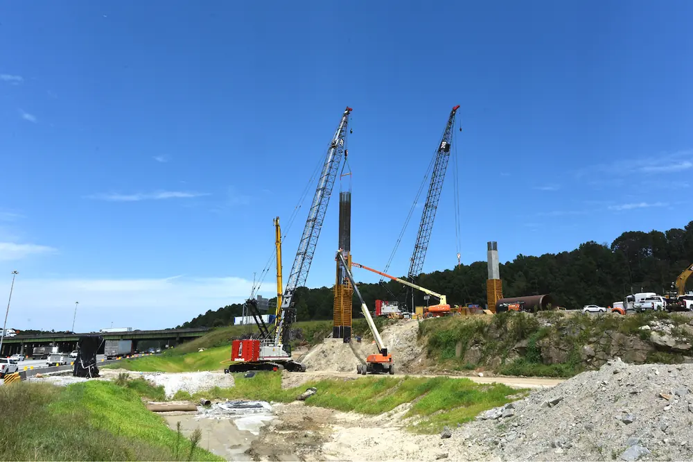 Link-Belt’s 150-ton 238 HSL lattice boom crane lifts a rebar cage on the I-285/I-20 West Interchange project.