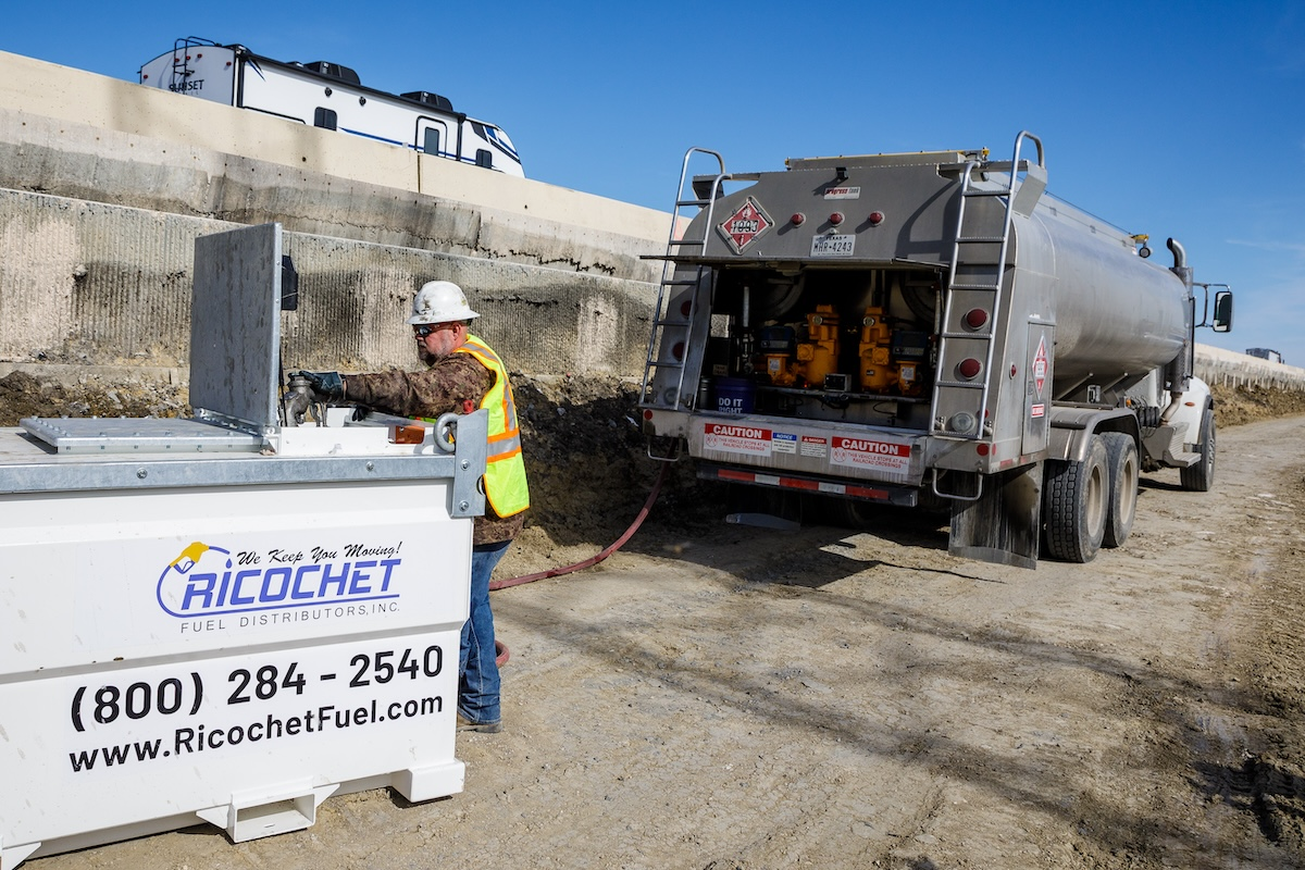 A fuel distributor fills a Western Global fuel tank, eliminating the need for workers to leave the job site to refuel.