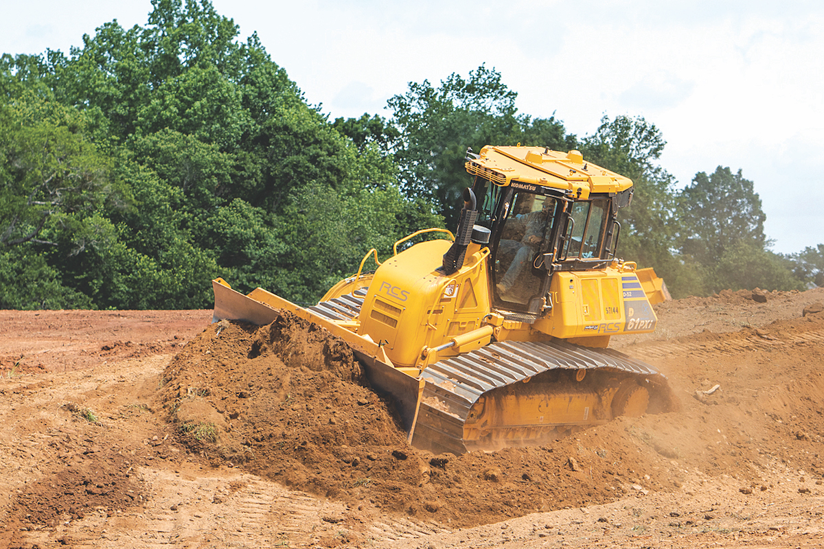 With a Komatsu D61PXi-24 IMC Dozer, an operator cuts to grade on a slope.