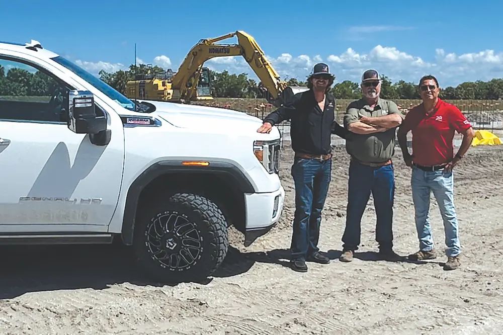 From left to right: Brent and Phil Baughman meet with Linder’s Dan Tafoya.
