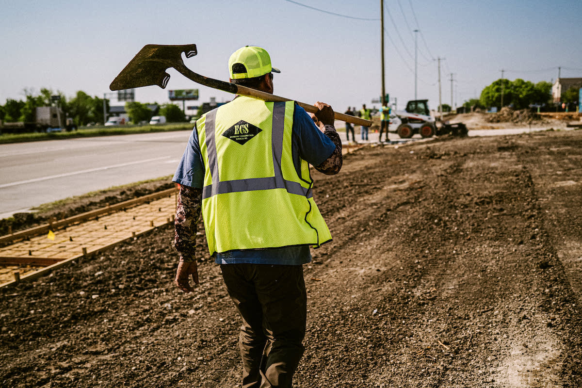 An ECS employee works on a job site.