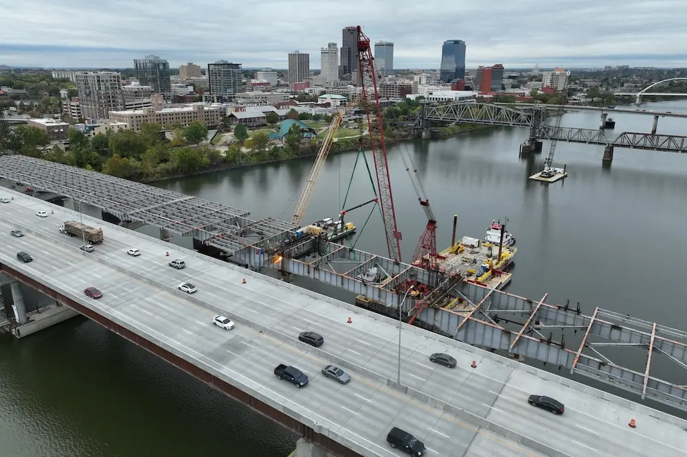 With the replacement bridge just 10 feet away, the non-redundant design and complexity of the old Arkansas River Bridge required detailed planning, temporary works, and disciplined field execution for its removal.