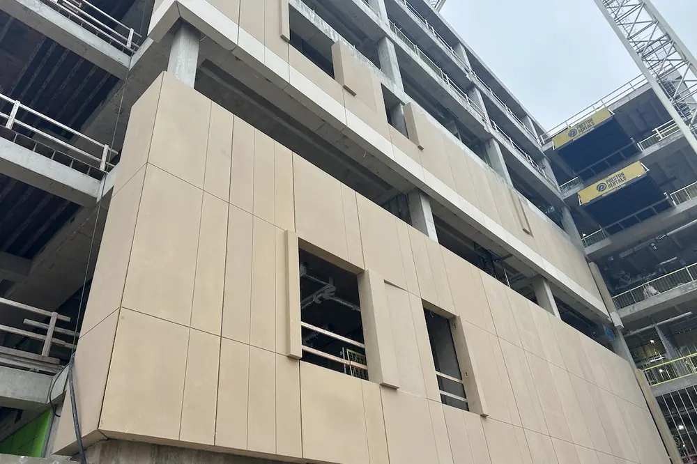 The building has architectural precast concrete panels across its facade.