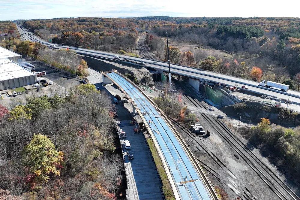 The I-495/I-90 interchange project features a series of major structural elements, including the construction of new bridges carrying both highways over rail lines.