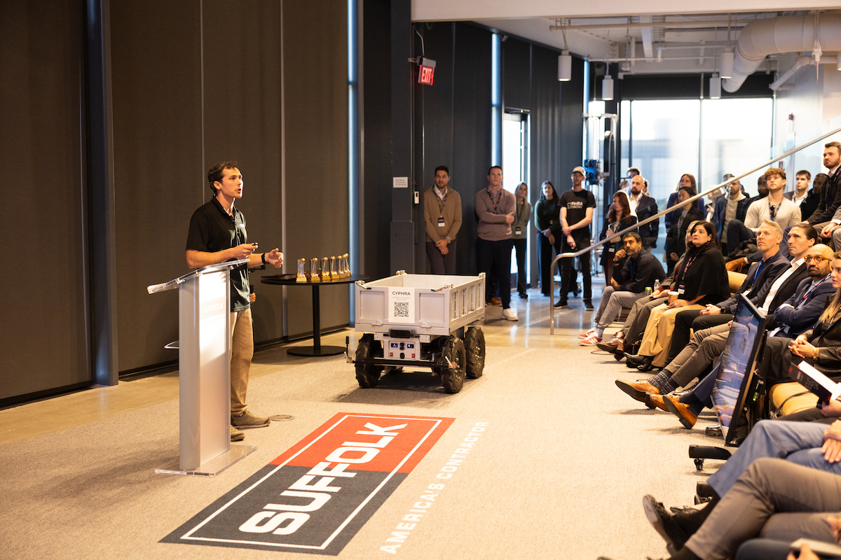 Cyphra Autonomy Founder and CEO Sean Ward pitched the startup's innovative, autonomous wheelbarrow system that automates heavy material hauling across construction sites, boosting efficiency and improving job site safety. The company received the "People's Choice Award" after a live vote at Demo Day.