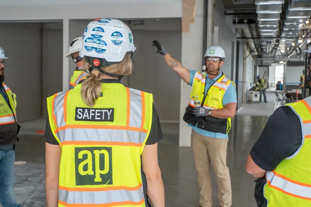 Adolfson & Peterson Construction (AP) Project Manager Matt Kloss shares with team members the preplanning that helped ensure quick, efficient completion of the firm’s new headquarters.