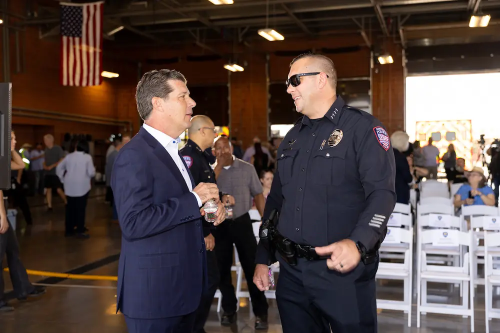 Surprise Police Chief Evan Becher (right) talks with Willmeng CEO James Murphy (left) before the start of the ceremonial groundbreaking event for the new Police Substation in Surprise.