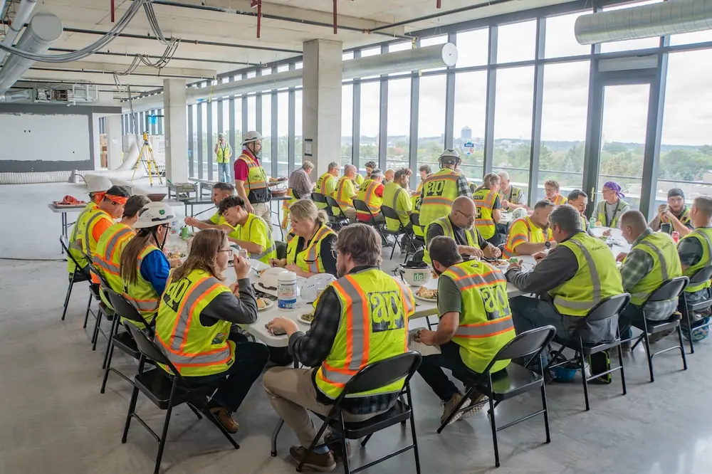 LaFreniere addressing the project team at a celebration lunch after reaching a critical project milestone.