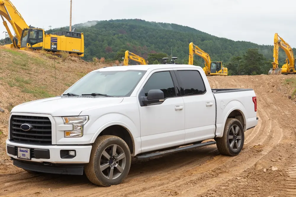 Connected supervisor trucks and UTVs help capture site data, monitor progress, and improve project visibility.