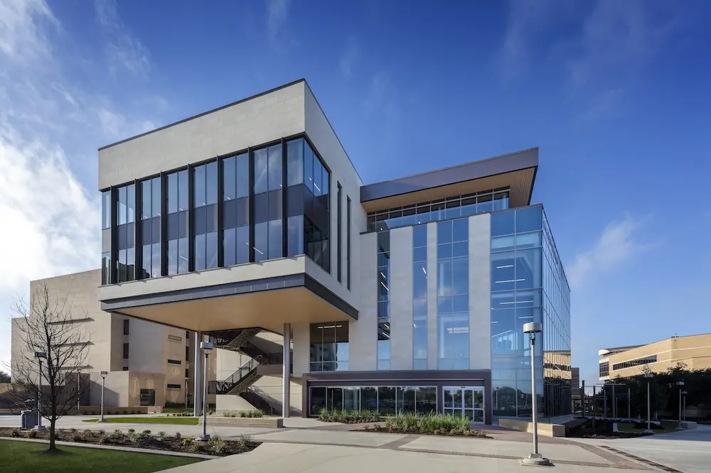The Texas A&M University Mays Business School Wayne Roberts '85 Building is a centerpiece of the new Business Education Complex in College Station, featuring the latest technology, a grand atrium, cafe, flexible learning studios, Collaboration Plaza, and the Center for Executive Development.