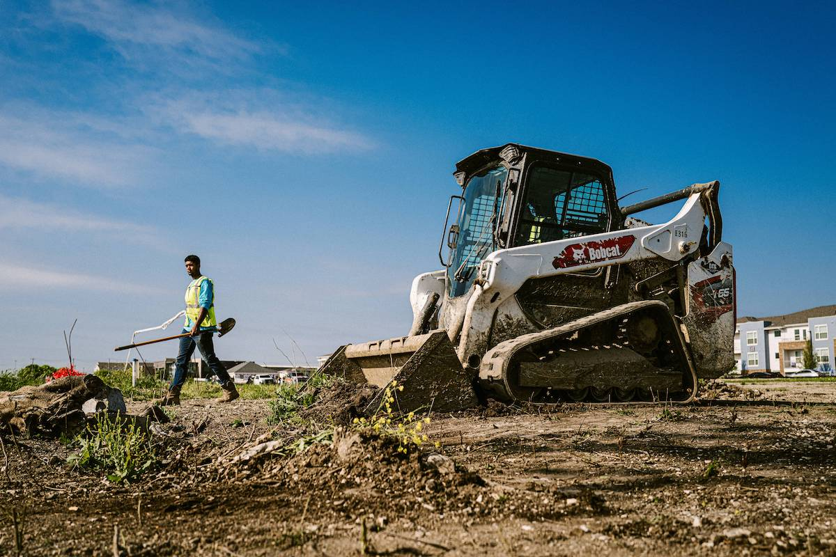 The team prepares a site for grading on a recent job.