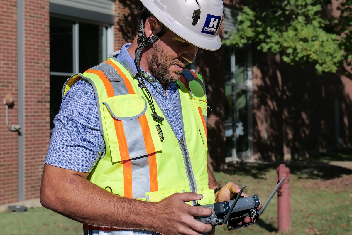 Bryce Barnes, Director of Innovation, using a drone on a Hardaway construction site.
