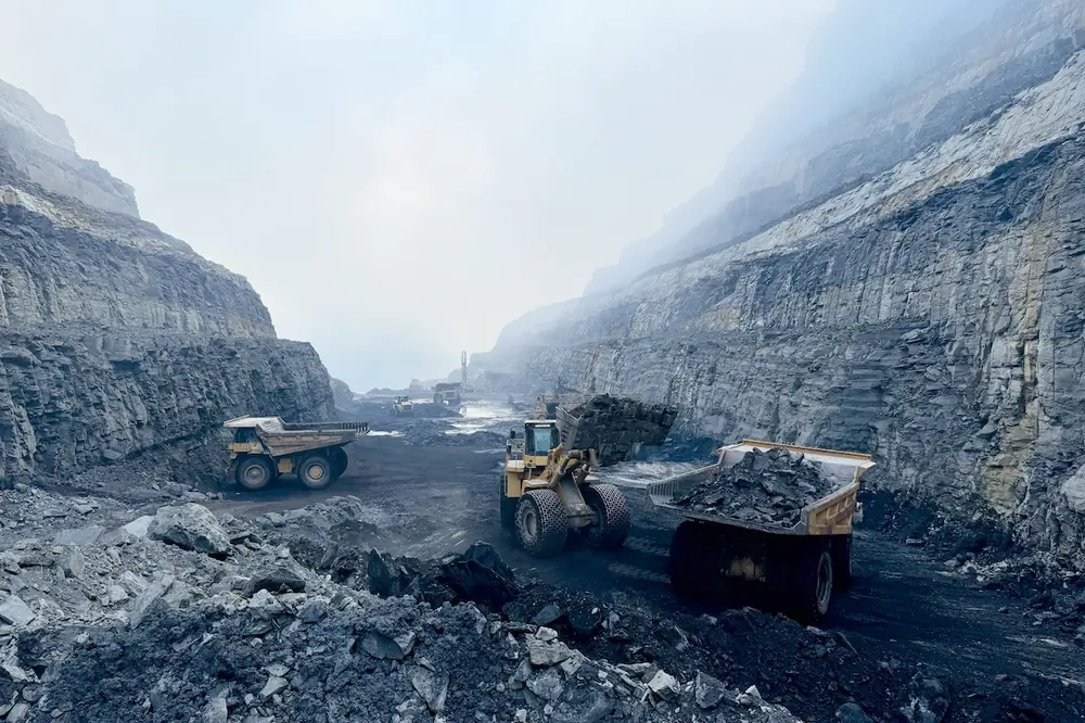 For the construction of Corridor Q in Virginia, a Caterpillar 777 Off-Highway Truck is loaded with shale by a Caterpillar 992 Wheel Loader.
