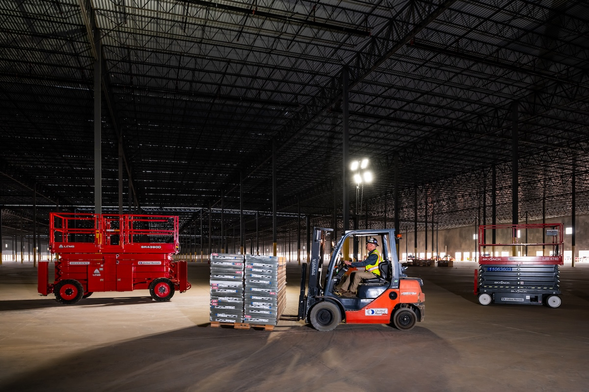 In low-light conditions, portable light stands help crews operate more safely.