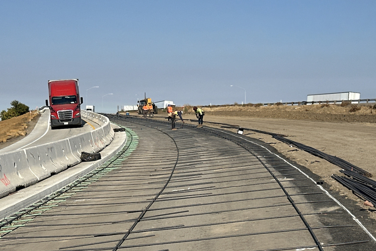 Crews work to install reinforcing steel to what will be the second lane of the State Route 120 connector to southbound State Route 99.