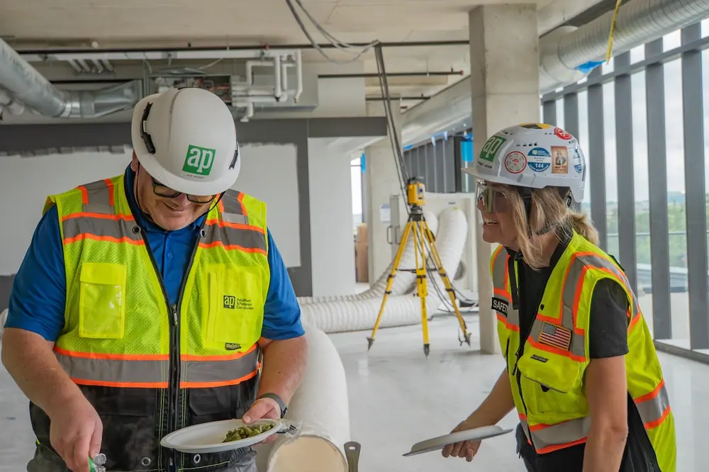 Whitney Larson, Safety Manager at AP, along with one of her mentors, Jack Webber, Vice President of Field Operations, celebrating a project safety milestone.