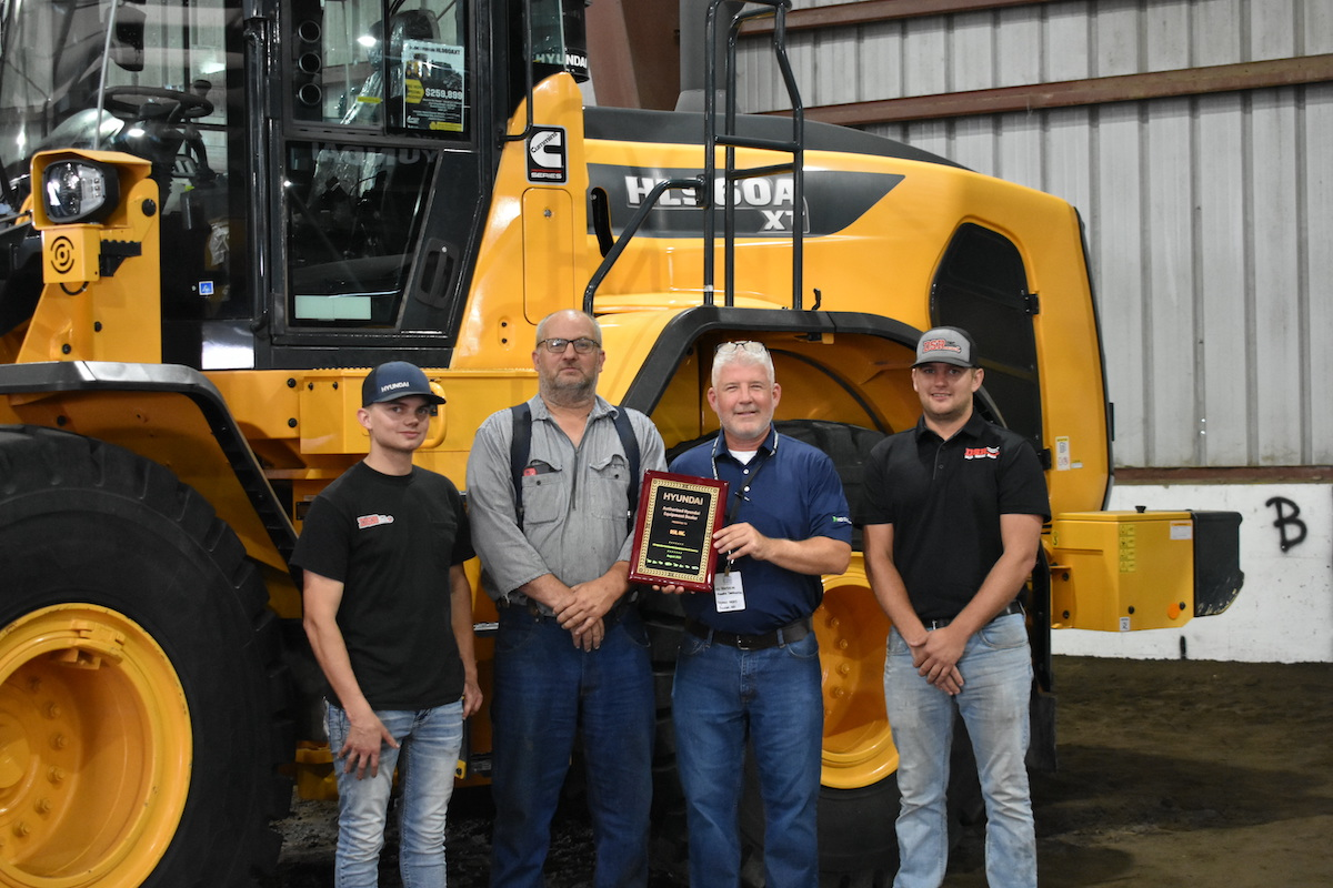 From left to right: Connor Reddig; Randy Reddig, DSR Founder and Owner; Ed Harseim, North Central District Manager, HD Hyundai Construction Equipment North America; and Trevor Reddig