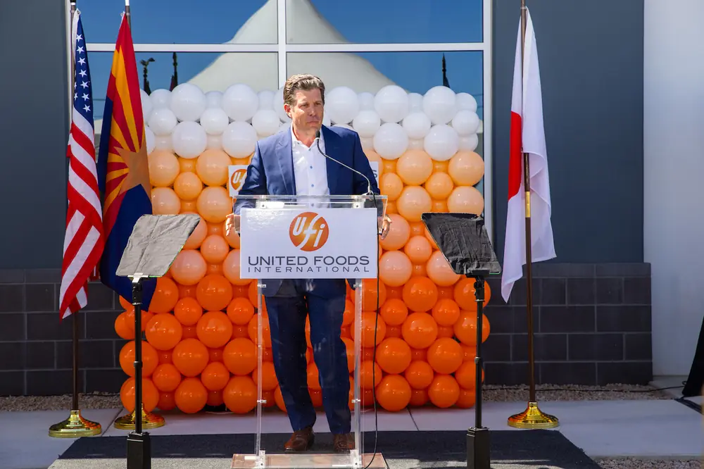 Willmeng CEO James Murphy speaks during the ribbon-cutting ceremony for the new United Foods International facility in west Phoenix.