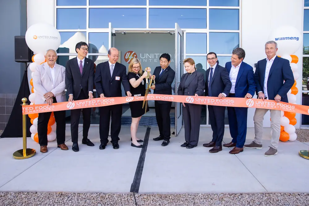 Phoenix Mayor Kate Gallego and United Foods International (USA) President and COO Take Shimura share the scissors during the ceremonial ribbon cutting for the new UFI facility in Phoenix.