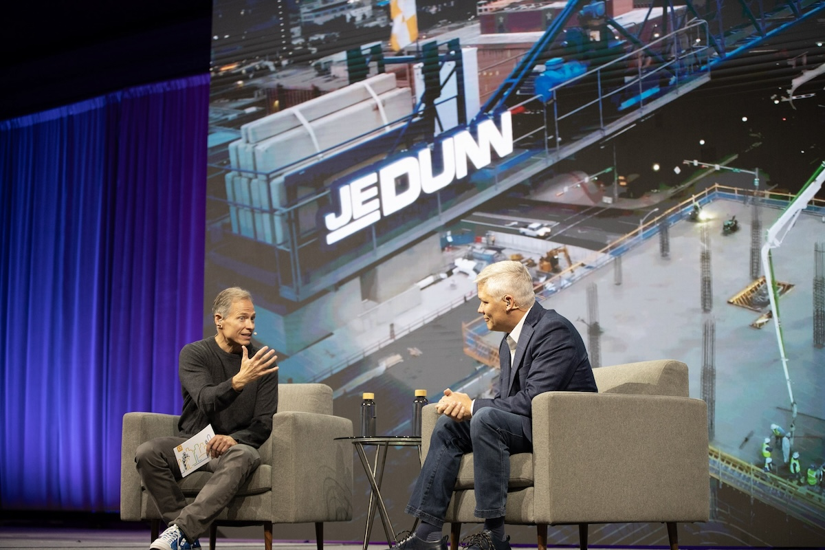 Rob Painter, Trimble’s CEO, and John Jacobs, Chief Information Officer at JE Dunn, during the keynote session at Trimble Dimensions 2025.